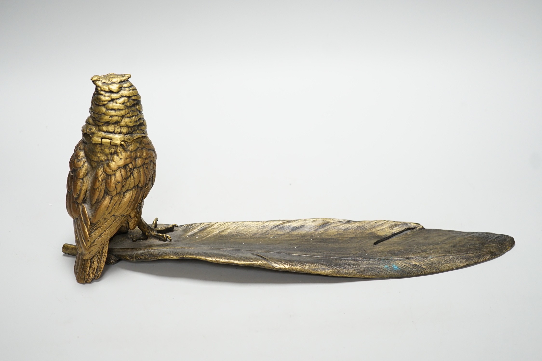 A bronze ‘owl and a feather’ inkwell with Bergman mark, 34cm long